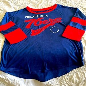 NBA for her 76er tee shirt